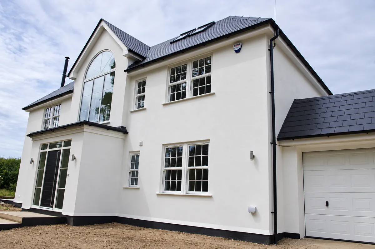 White rendered house with a two-storey extension in Sevenoaks