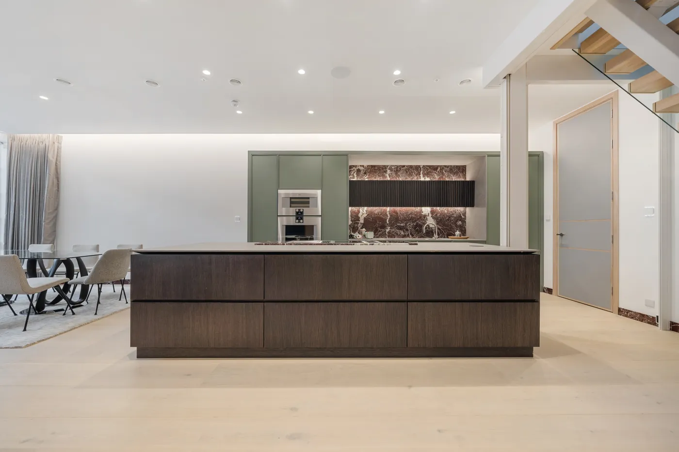 Kitchen island and dining area in the renovated Relton Mews house