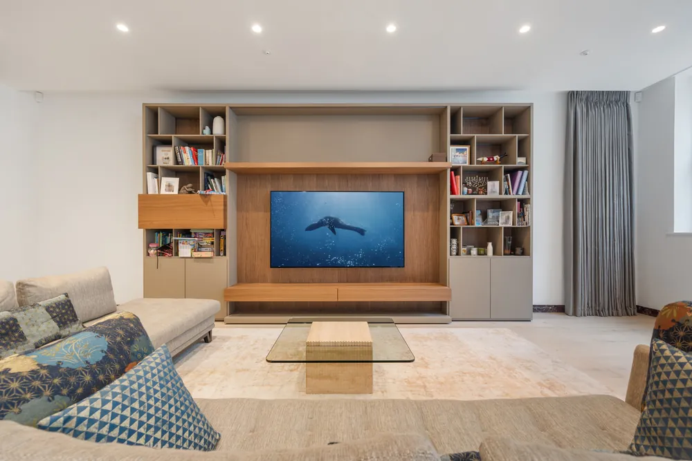 Living room with a built-in oak media wall