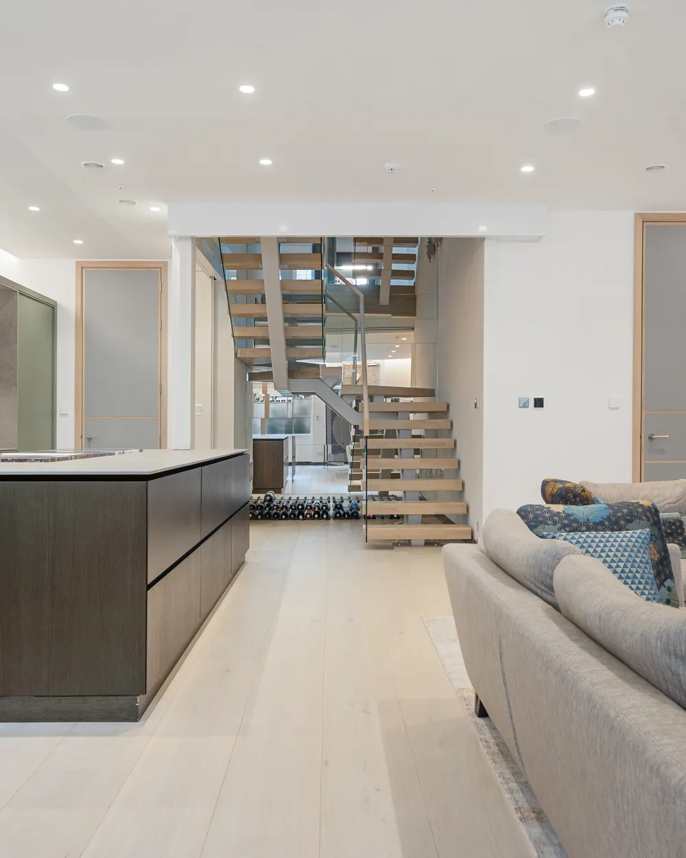 Open-plan kitchen and staircase created by removing internal walls in a South Kensington mews house